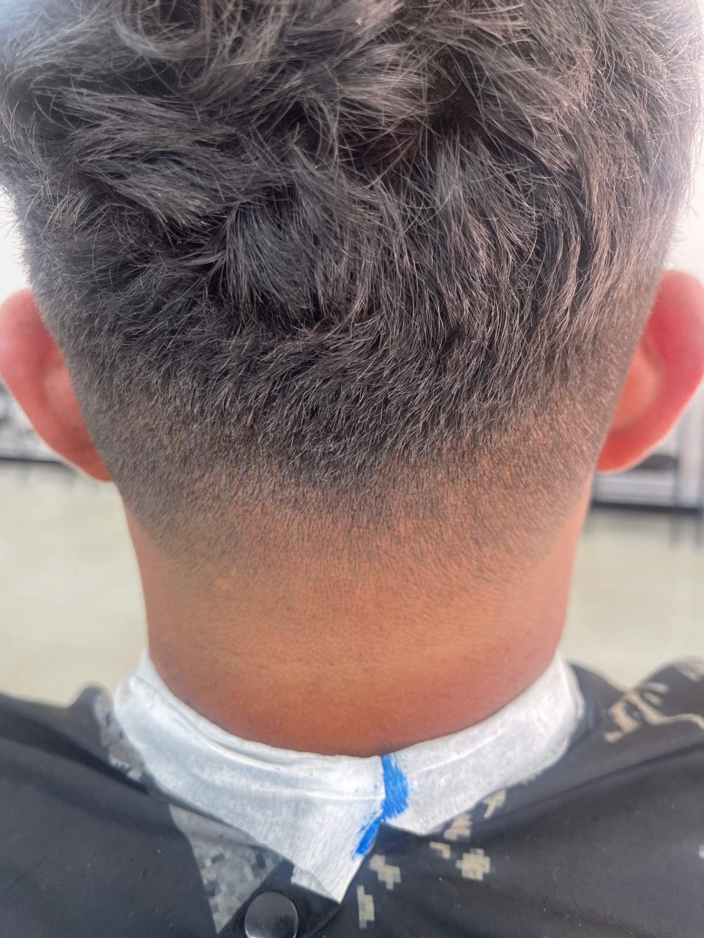 Textured top with smooth taper fade — back view
