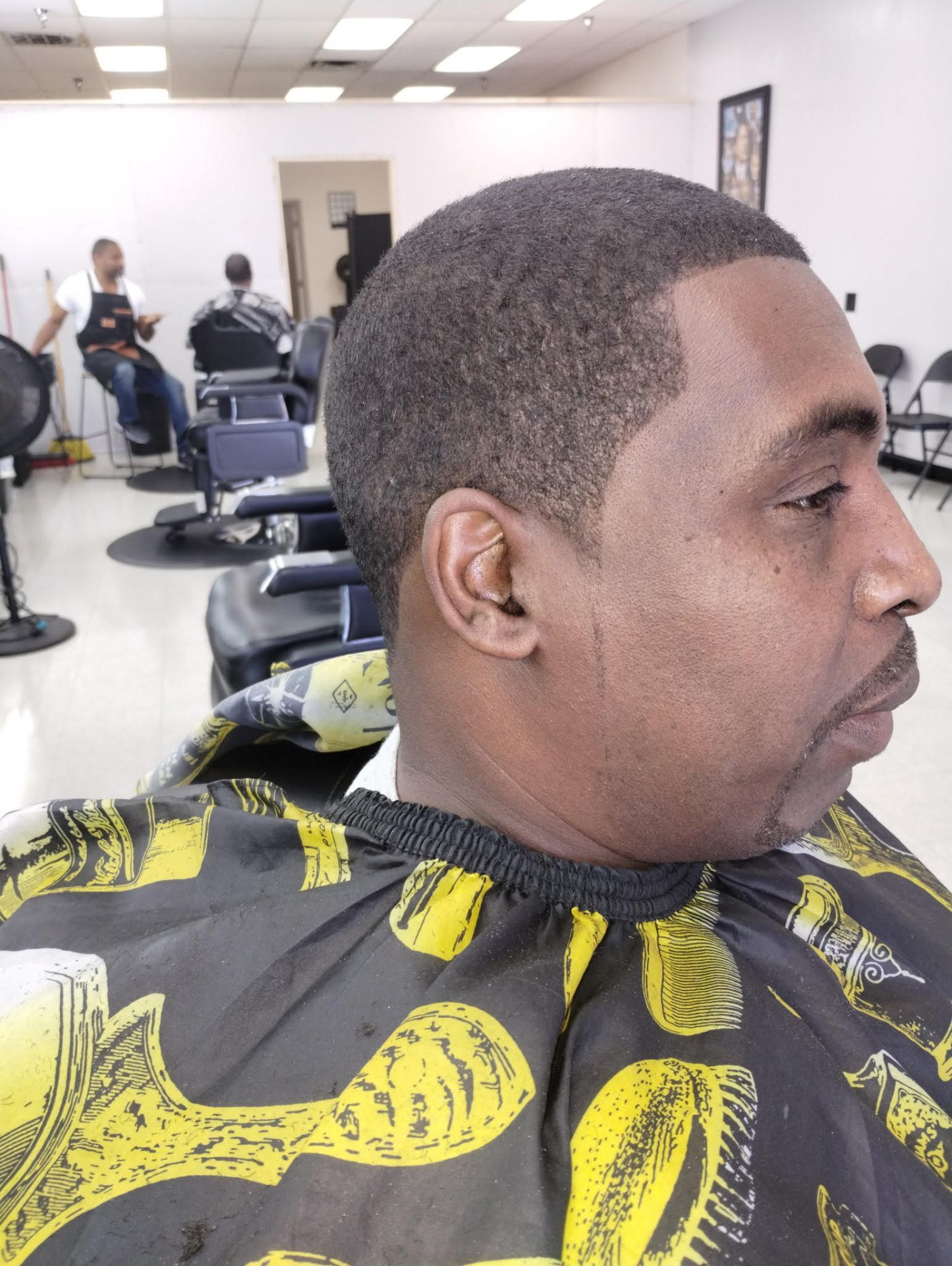 Low fade with crisp ear-to-ear lineup